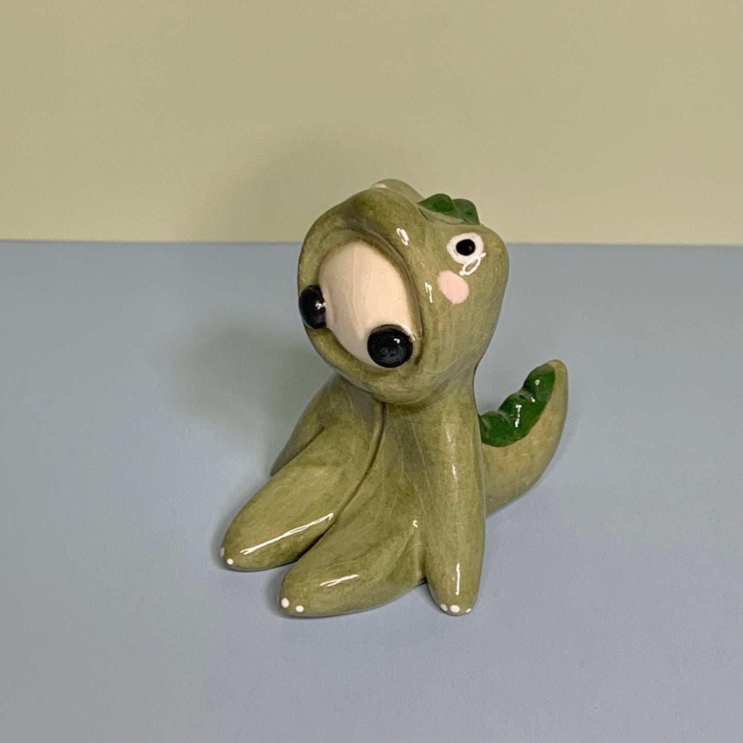 Cute Dino Costumed Ceramic Figurines