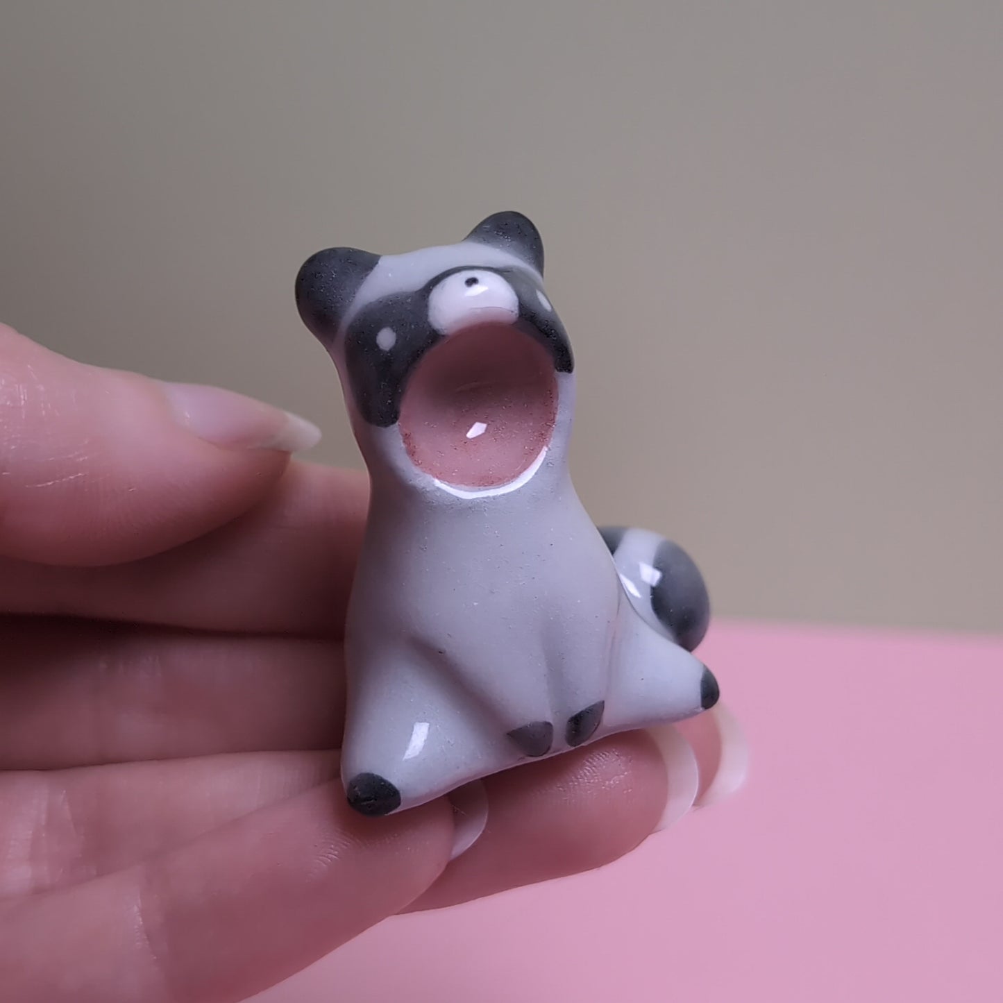 Screaming Raccoon Ceramic Figurine