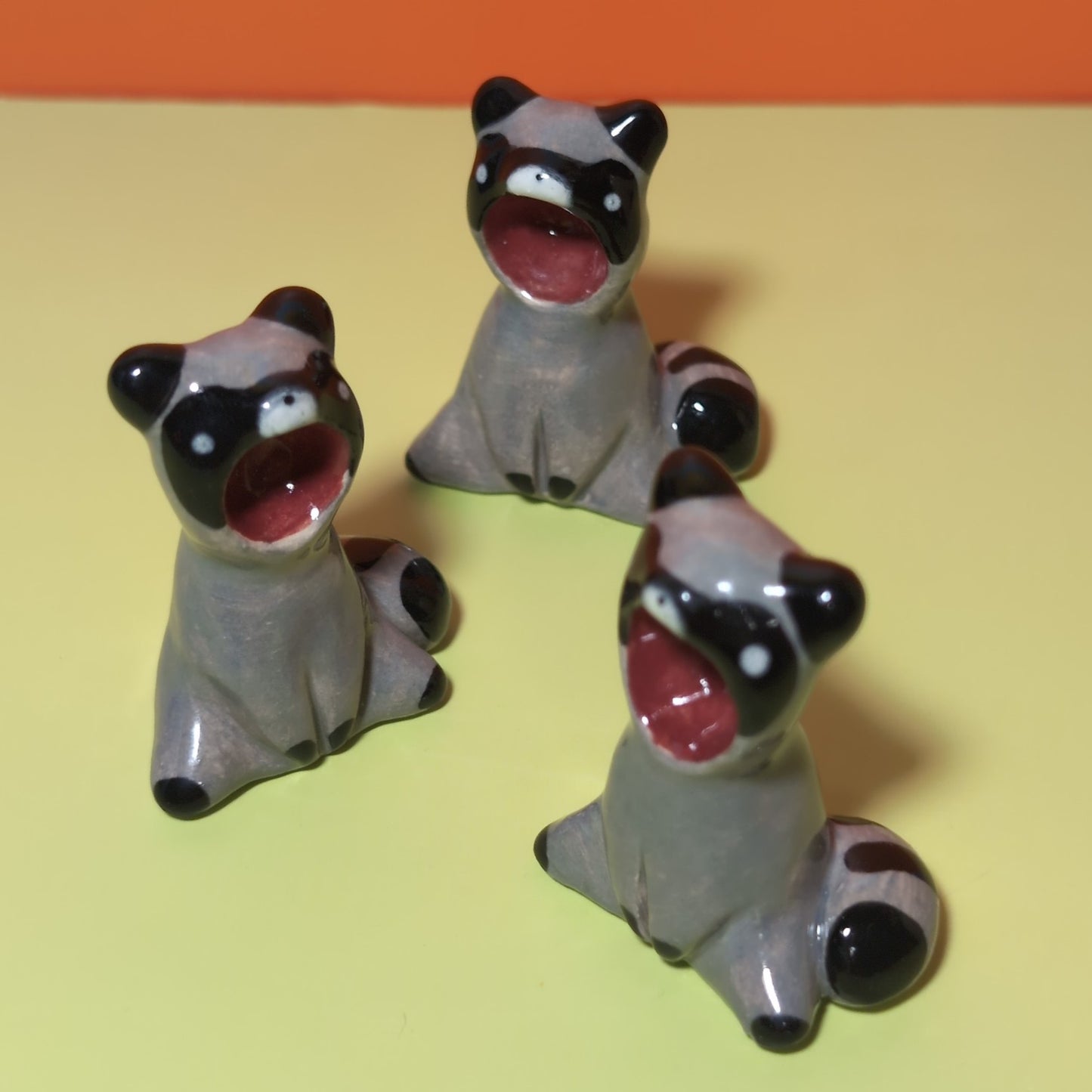 Screaming Raccoon Ceramic Figurine