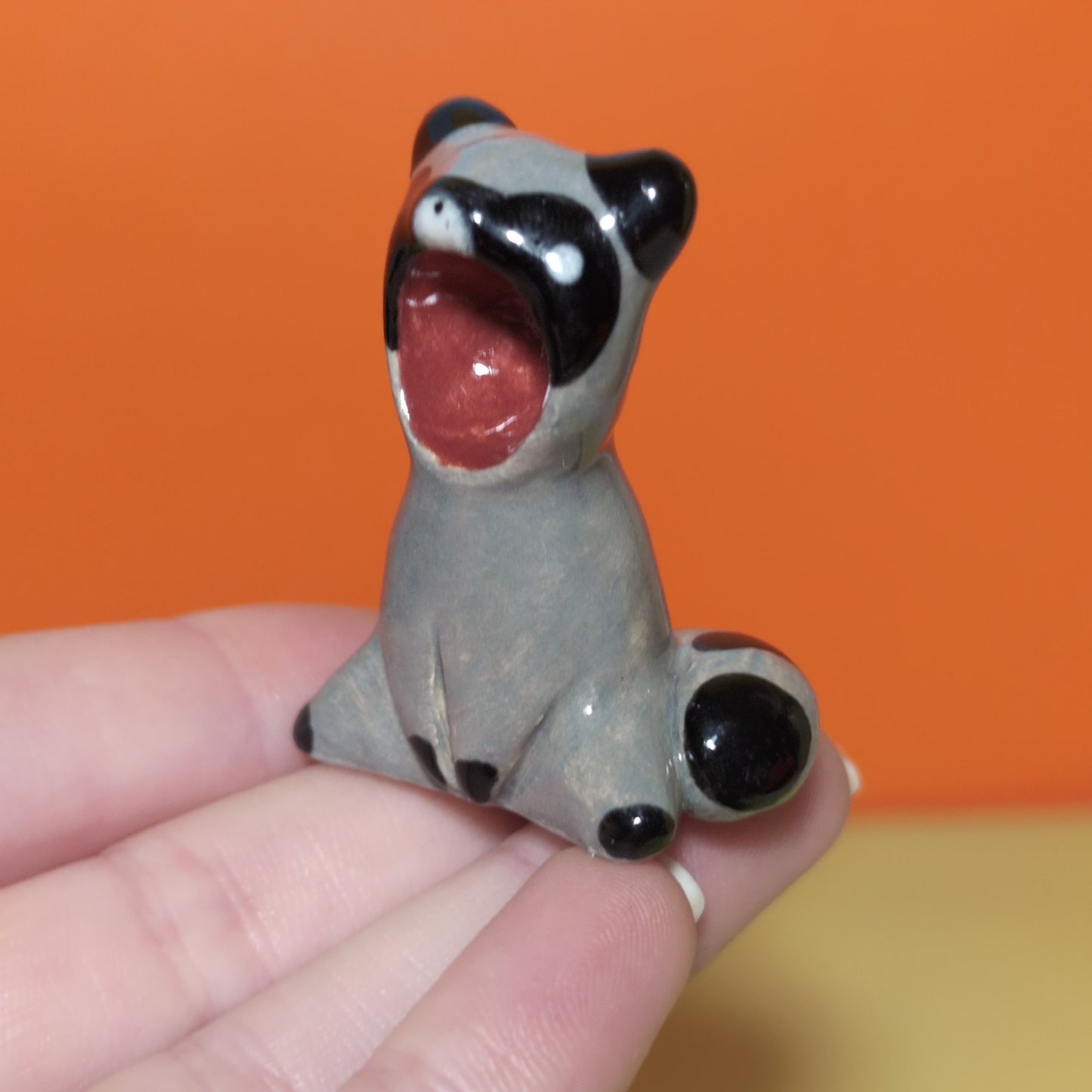Screaming Raccoon Ceramic Figurine