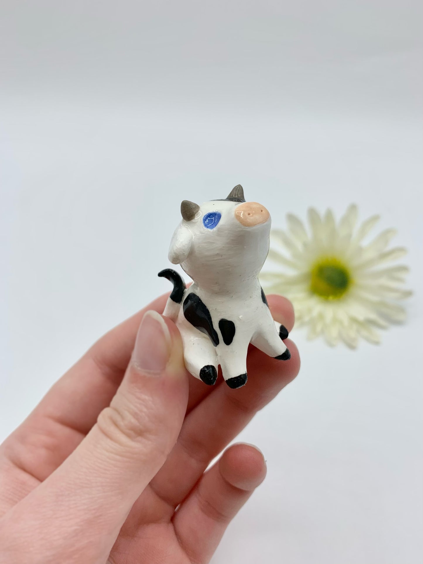 Ceramic Cow Figurine Sitting