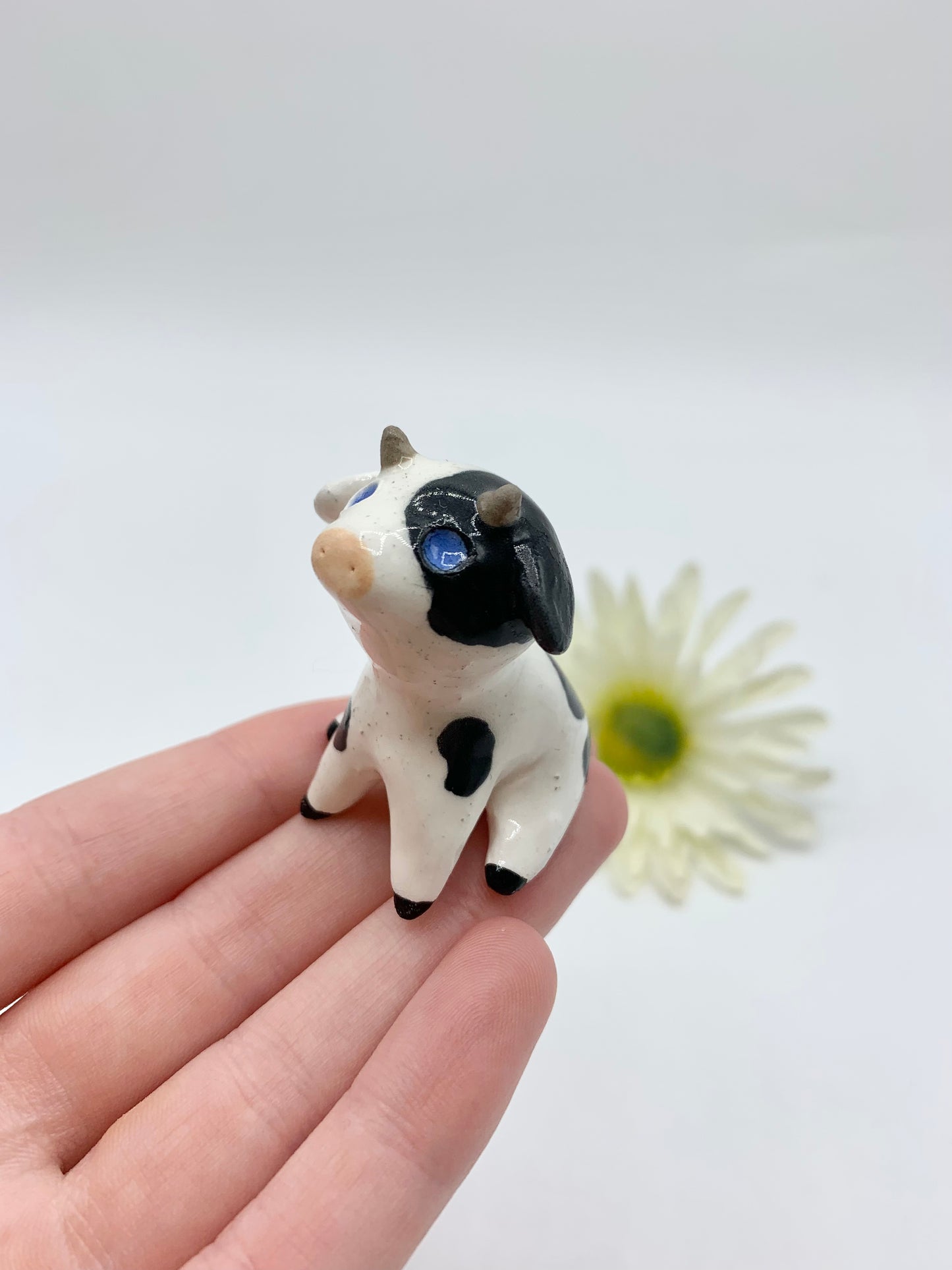 Ceramic Cow Figurine Sitting